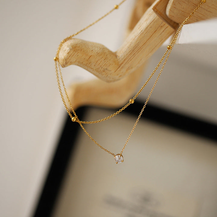 Duet Luxe — Dupla Camada com Pendente Dourado